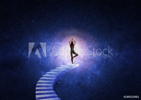 Picture of Woman in yoga position in front of the starry universe